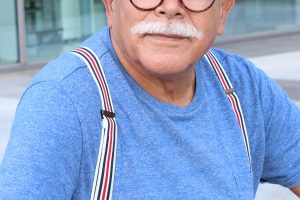 Man with mustache and suspenders