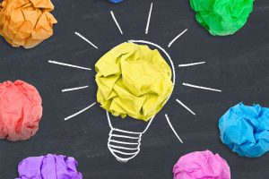 Crumpled pieces of colored paper finally spark a realization.