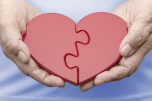 Two halves of a heart joined as one.