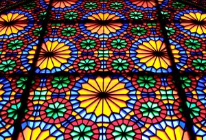 Stained glass window with rosette patterns