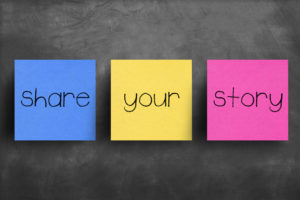 Sticky notes that say, “Share your story.”