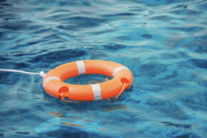 Life preserver floating in water