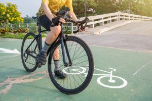 Woman riding a bicycle on a road