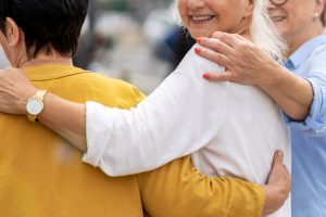 Woman smiling in the company of others